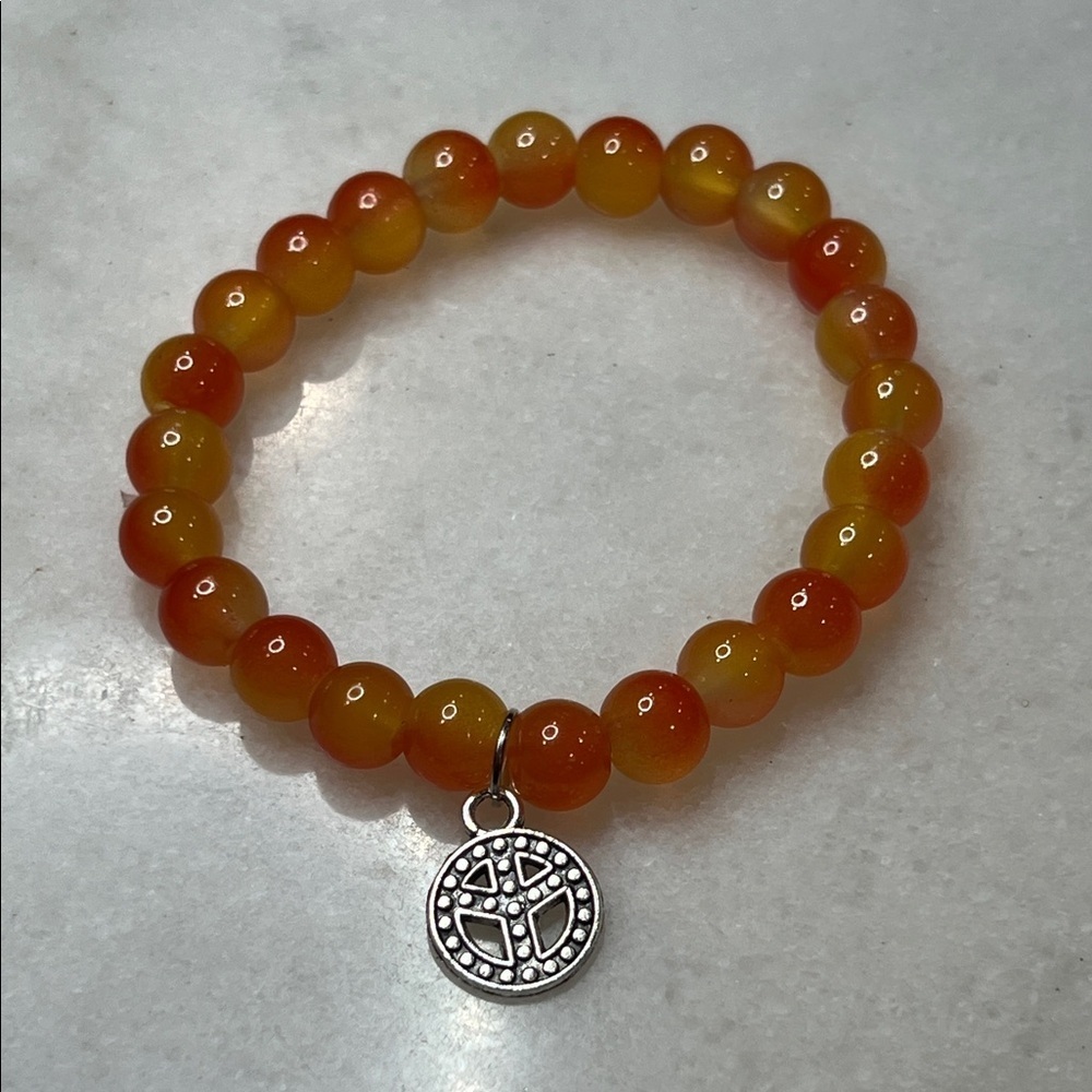 Vibrant Orange Beaded Bracelet with Silver Pendant